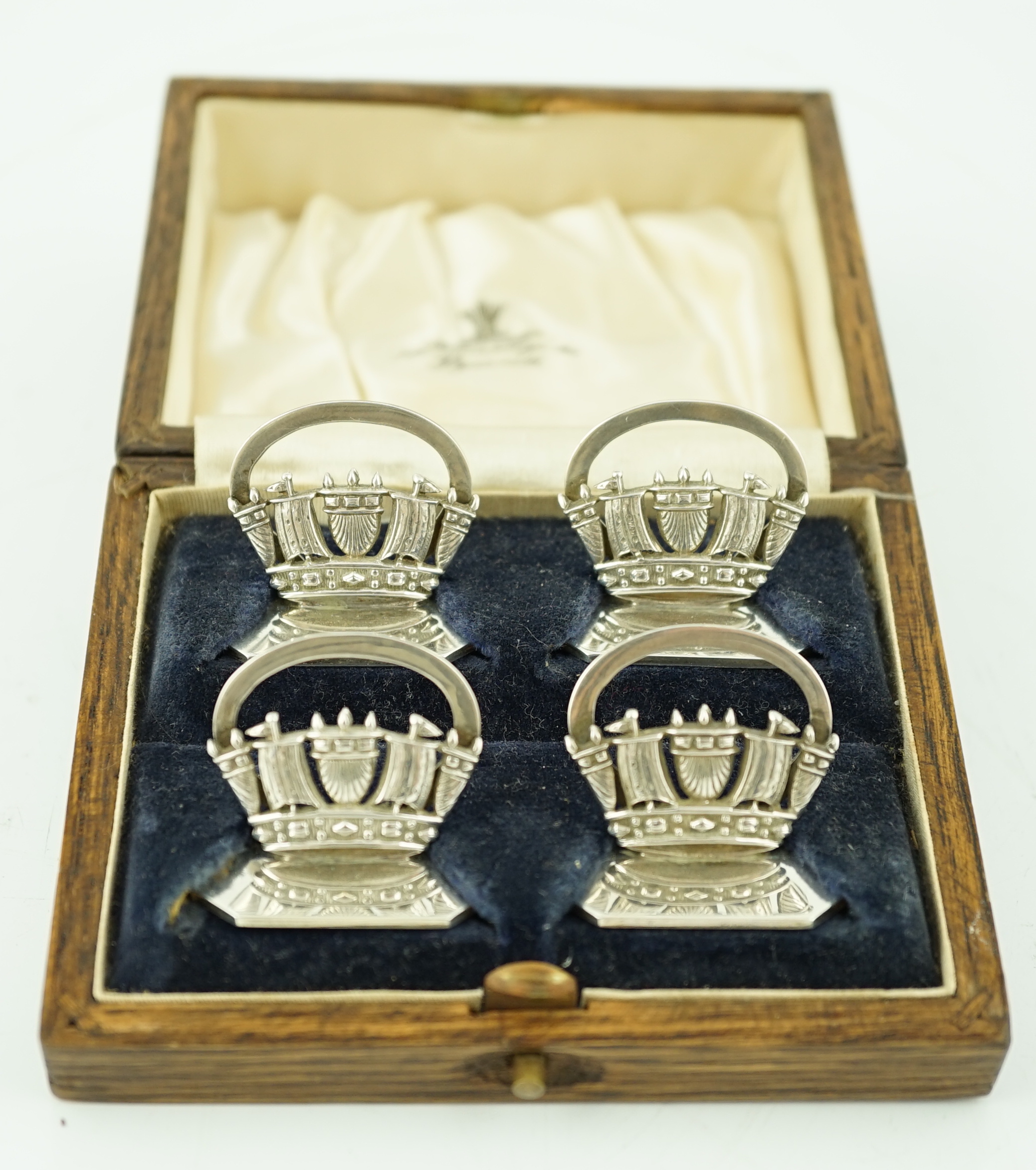 A set of four George V silver Royal Navy & Merchant Services menu holders, by John William Barrett